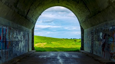 Tunnel and a view of the meadows. The tunnel under the 'Knybawa Bridge' over the Vistula River. Tczew