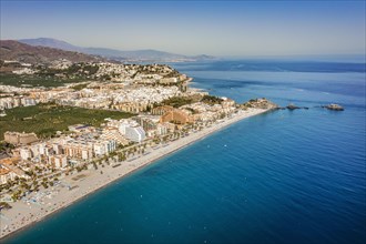 Aerial view of touristic coast in Almunecar by Mediterranean Sea