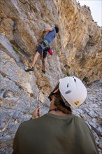 Climbing a rock face