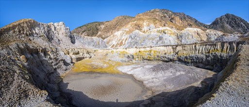 Crater with yellow discoloured sulphur stones