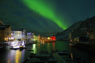 Northern lights (aurora borealis) over small harbour