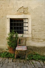 Old armchair in front of window