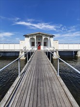 White cold bathhouse by the Baltic Sea