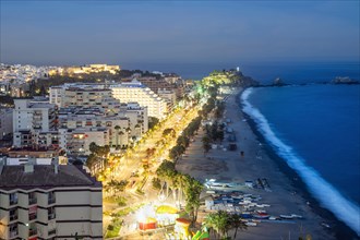 Panorama of touristic illuminated coast in Almunecar at night