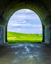 Tunnel and a view of the meadows. The tunnel under the 'Knybawa Bridge' over the Vistula River. Tczew