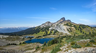 Blue lakes in front of Black Tusk volcanic mountain