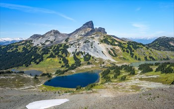 Blue lakes in front of Black Tusk volcanic mountain