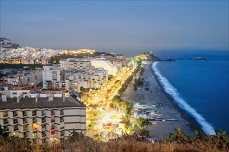 Panorama of touristic illuminated coast in Almunecar at night