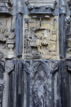 Old sculptures in need of renovation at the entrance gate to Notre-Dame Cathedral in Tournai