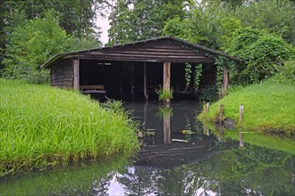 Historic boat shed on a river