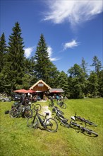 Mountain bikes standing in front of the Moosalm near the Schwarzensee