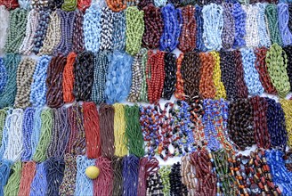Colourful beads sale on a platform at Mylapore