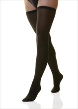 Womans legs in black stockings