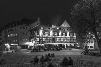 Historic inn in the old town with young people in the evening