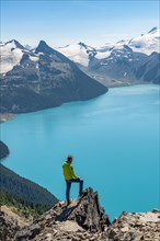 Young man standing on a rock