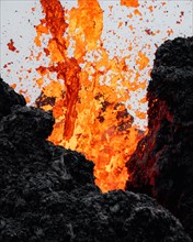 Erupting volcano with lava