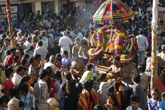 The Sixty three Nayanmars (Arupathumoovar) are borne in palanquins and precede the giant sculptured chariot which bears the deities