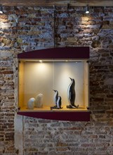 Display case with mouth-blown animal statues