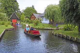 Tourists in Spreewald barges in the village of Lehde