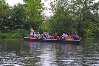 Tourists in typical barges along the Spree