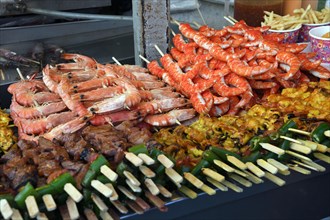 Various skewers with meat and seafood