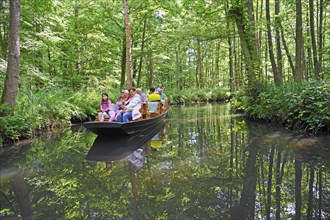 Tourists in typical barges along the Spree