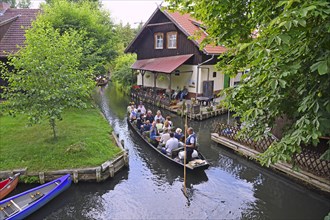 Tourists in Spreewald barges in the village of Lehde