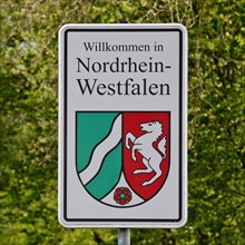 Sign Welcome to North Rhine-Westphalia with State Coat of Arms