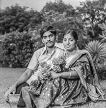 South Asian Indian young man in shirt and women in silk saree (couple)