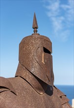 Metal statue of knight in armor
