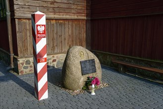 Memorial stone at the wooden church