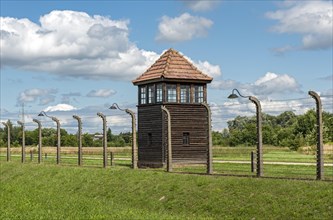 Barbed-wire fence and guard tower at Auschwitz II-Birkenau concentration camp