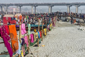 Pilgrims cross the Ganges on a makeshift pontoon bridge