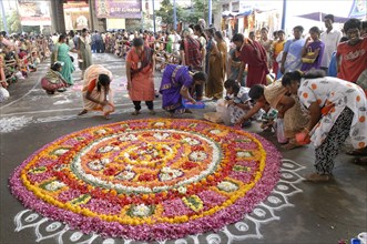 Kolam and floral decoration in front of Kapaleeshvara temple during a festival