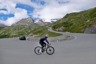 Road cyclists on the Bernina mountain pass