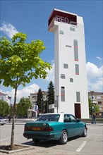 Mercedes taxi in front of Red Tower observation tower at Theatre Square