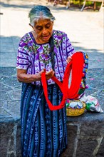Demonstration of how to tie a typical headdress of the Tzutuhil woman