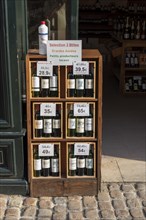 Wine bottles in front of a shop