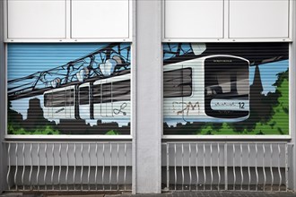 Suspension railway painted on roller blinds in the centre of Elberfeld