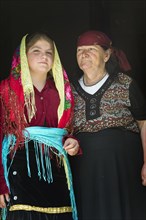 Grandmother and granddaughter in traditional dress