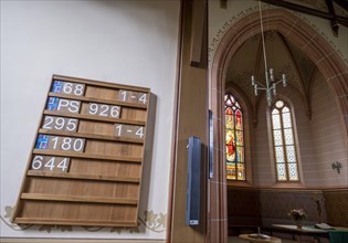 Panel with posted songs in the protestant town church