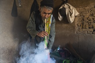 Sufi man smoking marihuana