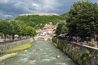 River Bistrica with stone bridge and fortress