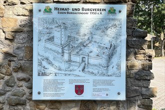 Tourist information board on ruins of partially restored Altendorf Castle from the Middle Ages