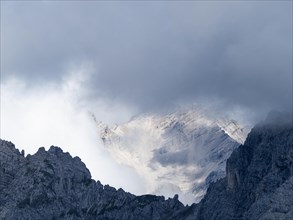 View from the Hafelekarspitze on misty mountain peaks in the Karwendel mountains