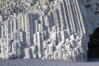 Basalt formations on a dark beach
