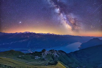 View of Lake Brienz with starry sky and Milky Way from Brienzer Rothorn