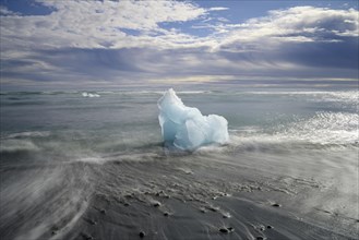 Iceberg on the black lava beach Diamond beach
