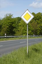 Road sign "Vorfahrtstraße" on a country road