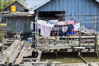 Laundry hanging in front of a hut on the Sekonyer River